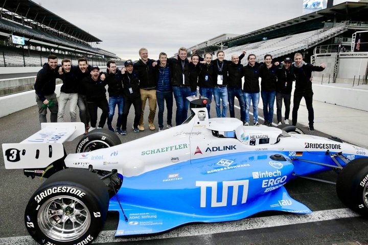 The "TUM Autonomous Motorsport" team with its race car in Indianapolis